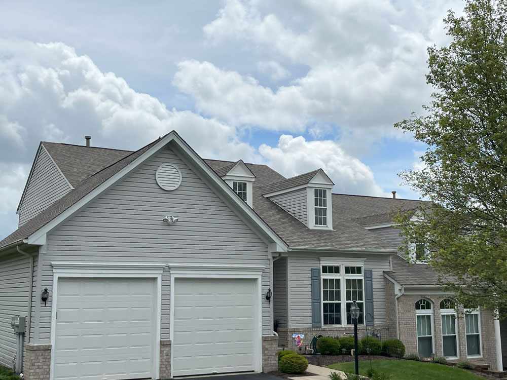 This house in Bridgeville, PA was transformed into a beautiful property with an updated, new roof. Our roofers installed Landmark Pro shingles from Certainteed.