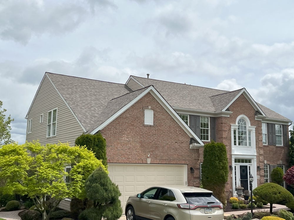 This house in Houston, PA was transformed into a beautiful property with an updated, new roof. Our roofers installed Landmark Pro shingles from CertainTeed. 