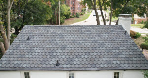 Explore stunning images of a new roof installation in Mt. Lebanon, PA, featuring CertainTeed Carriage House Stonegate Grey shingles. See the elegant slate-inspired design and superior craftsmanship up close!