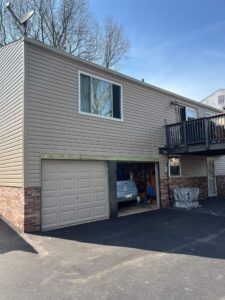 New siding installation featuring Perfection siding and Pebblestone Clay Dutch Lap siding by Knox’s Construction in Bethel Park, PA.