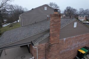 Complete exterior renovation in Bethel Park featuring Montana Suede siding and CertainTeed Pro Shingles.