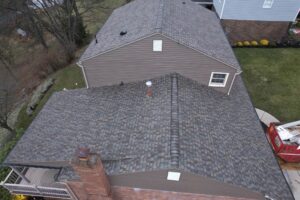 Complete exterior renovation in Bethel Park featuring Montana Suede siding and CertainTeed Pro Shingles.
