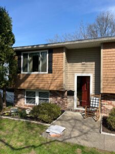 New siding installation featuring Perfection siding and Pebblestone Clay Dutch Lap siding by Knox’s Construction in Bethel Park, PA.