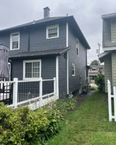 Modern Exterior Remodel in Pittsburgh Featuring Black Soffit and Slate Siding