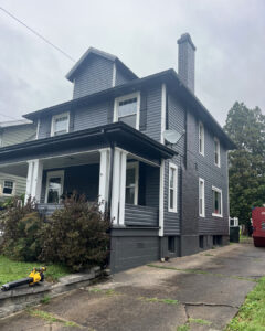 Modern Exterior Remodel in Pittsburgh Featuring Black Soffit and Slate Siding