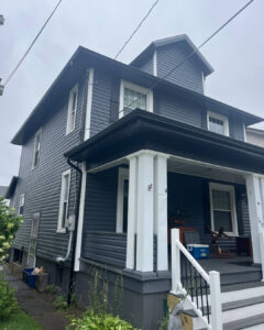 Modern Exterior Remodel in Pittsburgh Featuring Black Soffit and Slate Siding