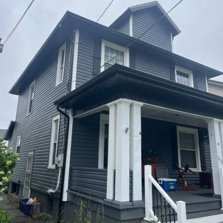 Modern Exterior Remodel in Pittsburgh Featuring Black Soffit and Slate Siding