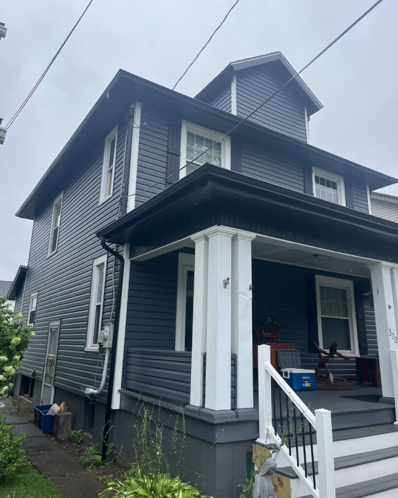 Modern Exterior Remodel in Pittsburgh Featuring Black Soffit and Slate Siding